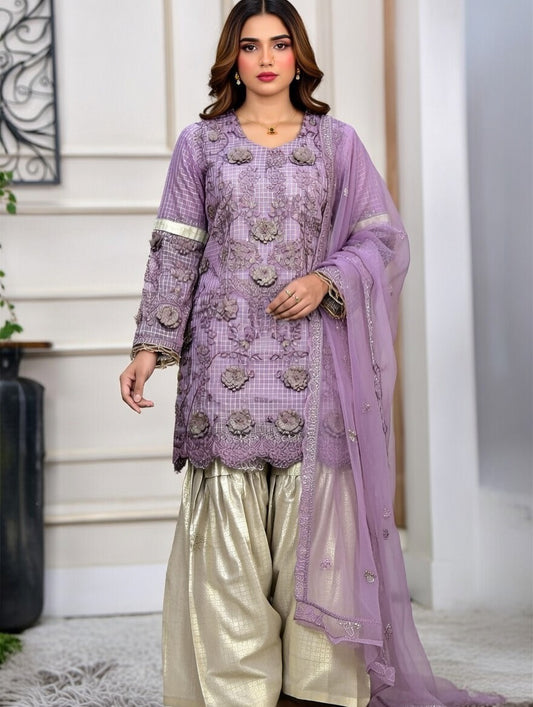 Purple and gold sharara suit.