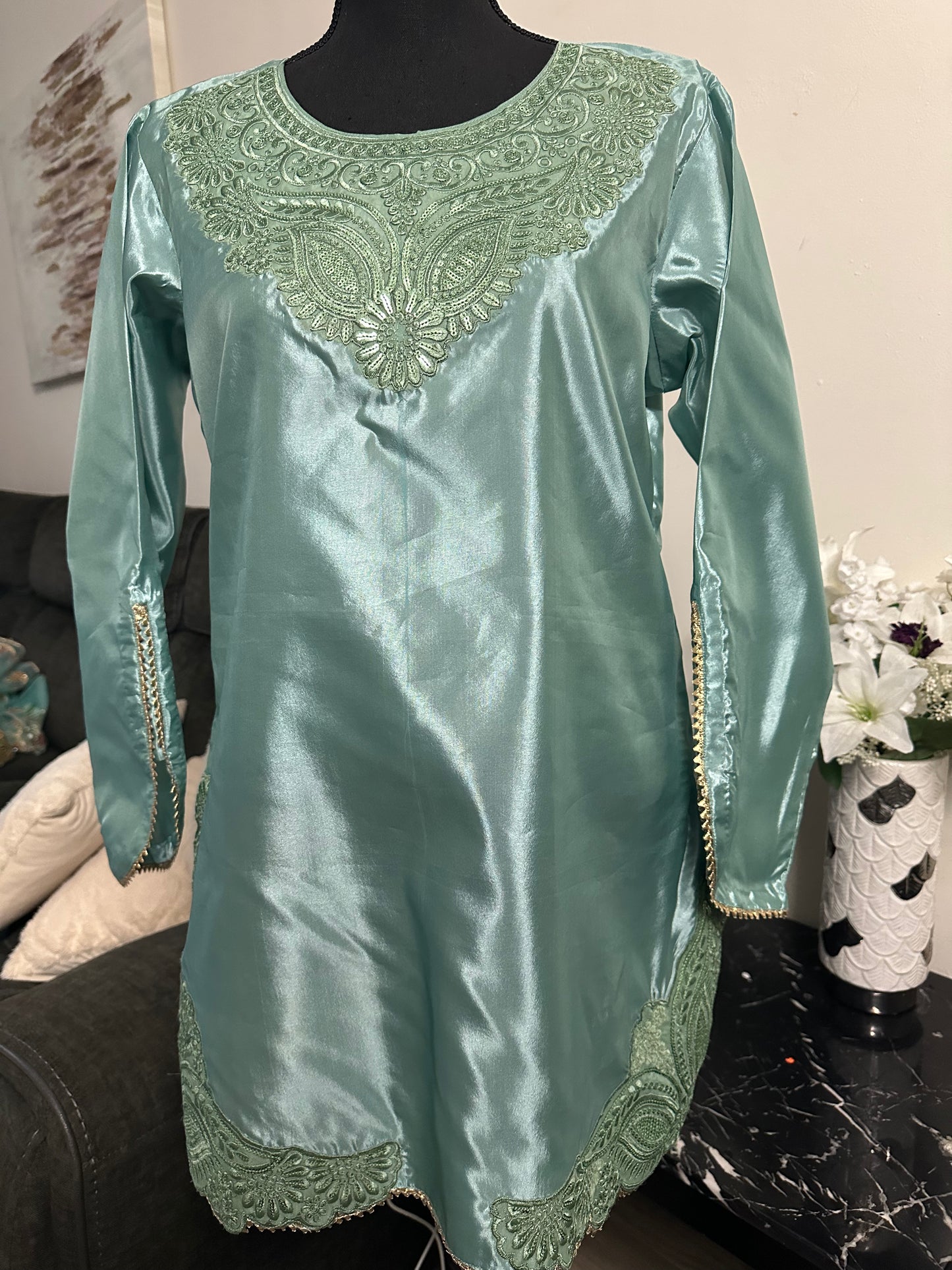 See green Farshi shalwar set.