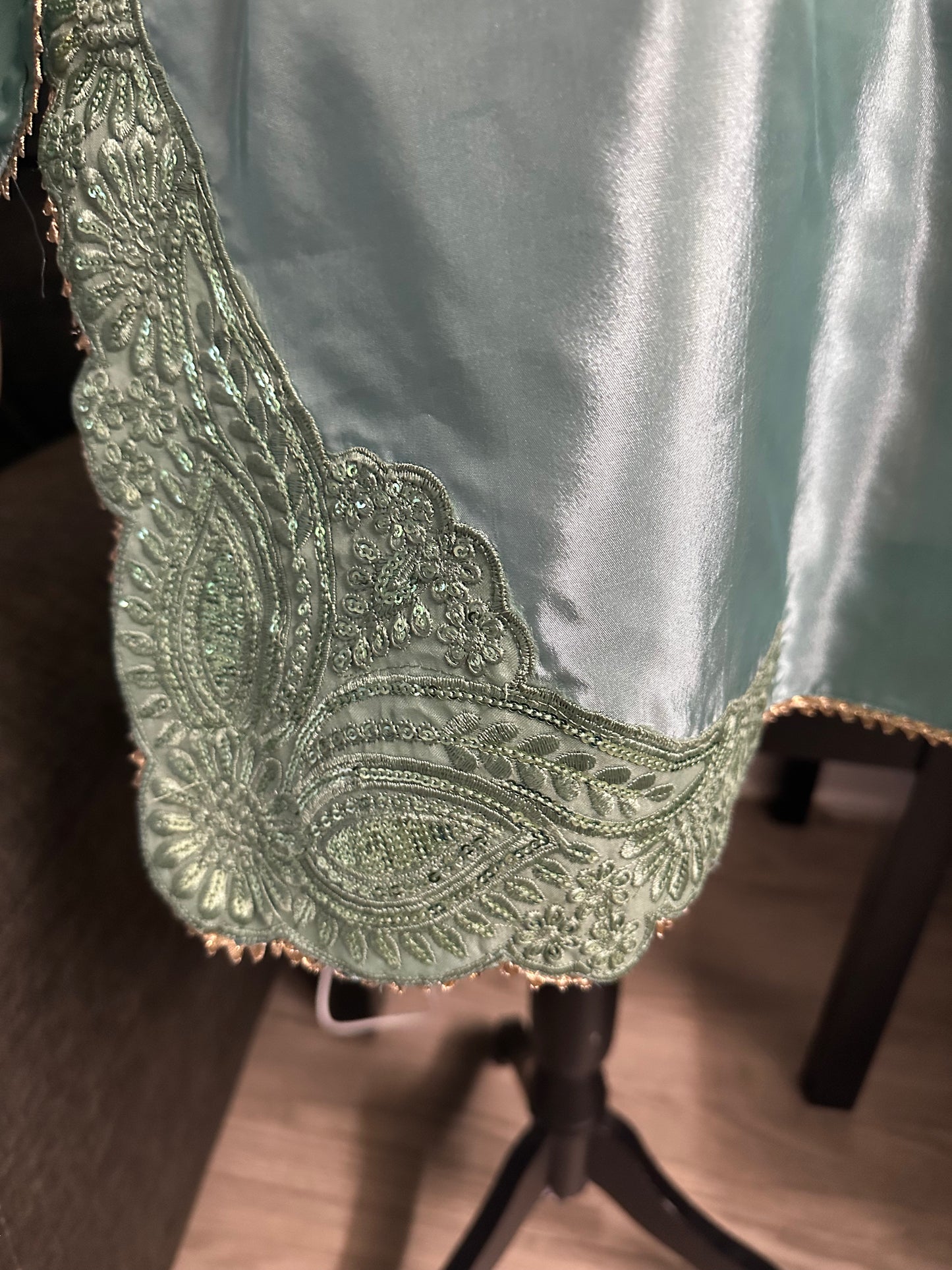 See green Farshi shalwar set.