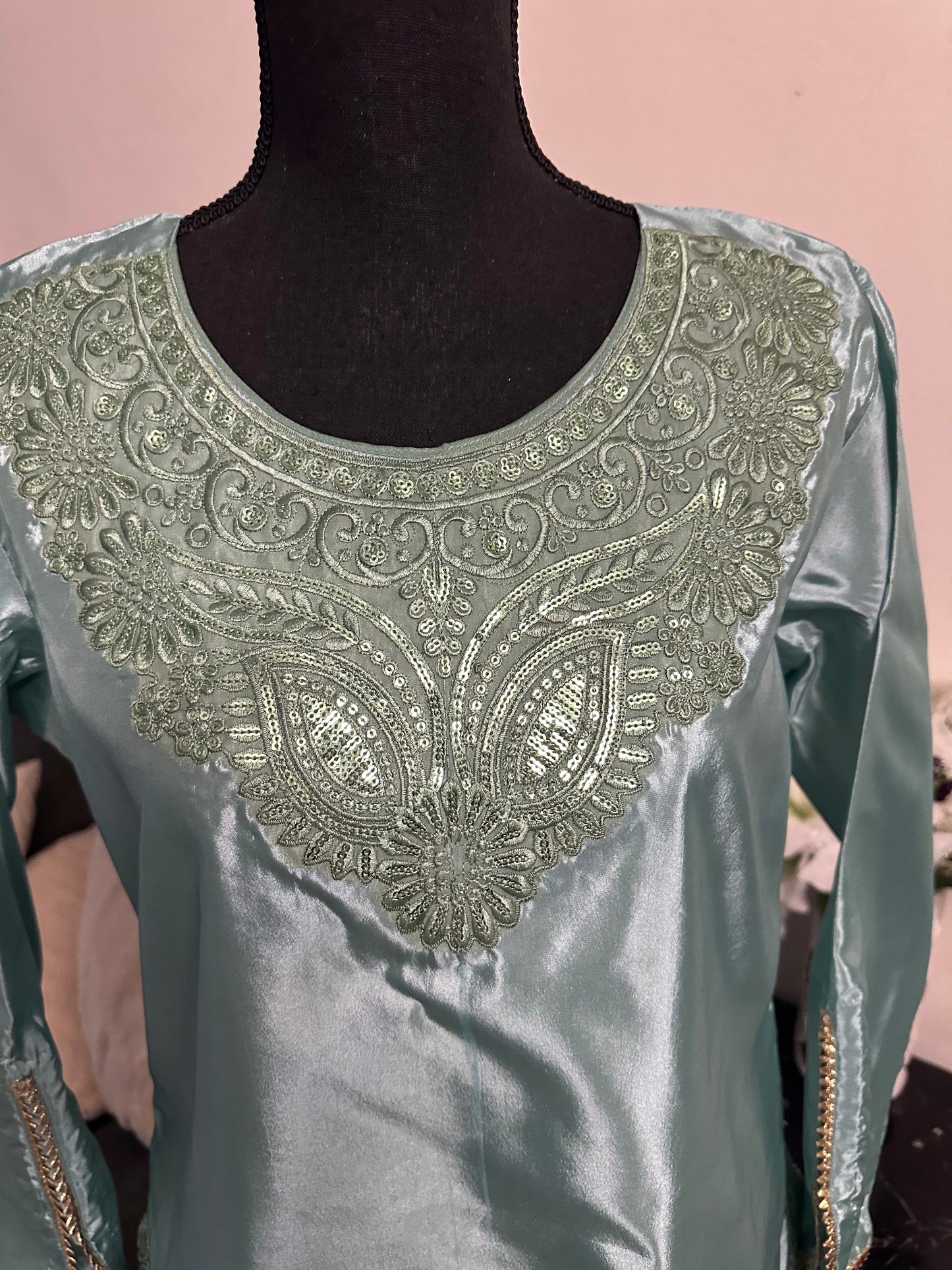 See green Farshi shalwar set.